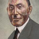A portrait of a distinguished Black man wearing a grey suit.