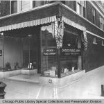 A black and white photo of a storefront branch library.