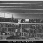 Black and white photo of the interior of a library.