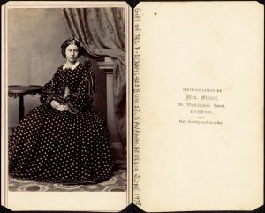 Image of two pages of a book with a portrait photo of a woman sitting in a chair at left.
