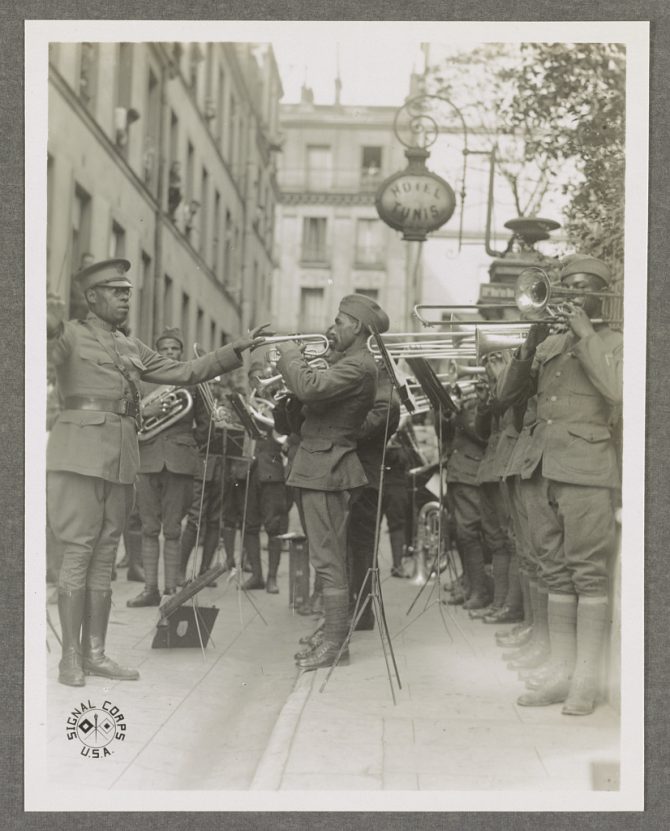 Photograph shows African American musicians in the 369th Infantry Regiment band led by James Reese Europe.