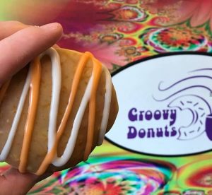 Groovy Donuts logo pictured next to a donut