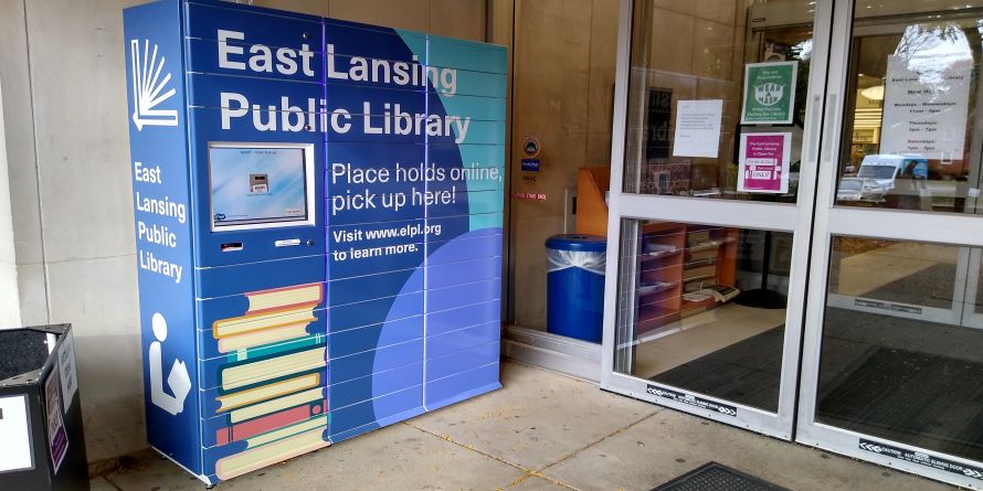 Library lockers for holds pickup, located outside the library's main entrance.