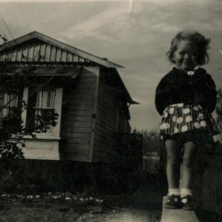 Betty Martin standing in front of her house on Hornbrook Street, Temuka. 1920s. CCL-PH17-042