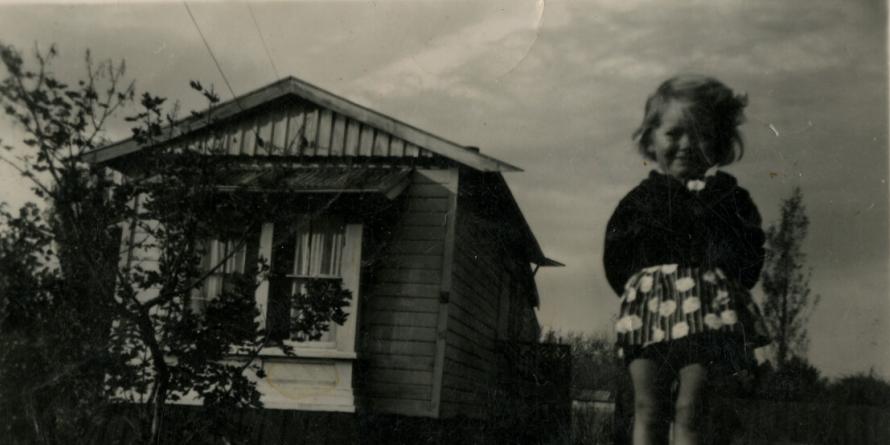 Betty Martin standing in front of her house on Hornbrook Street, Temuka. 1920s. CCL-PH17-042