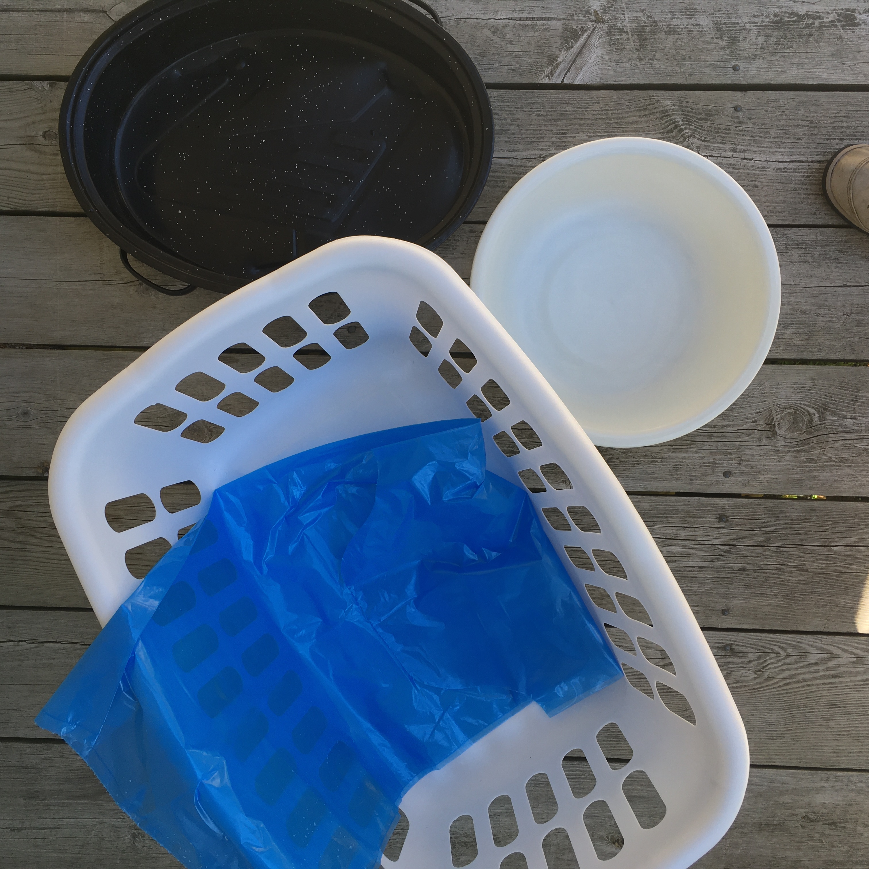 laundry basket, roasting pan, bucket, and blue bag