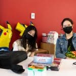 Two girls take part in a Pokémon event at Halifax Central Library