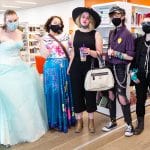 A group of 5 teens poses in their cosplays together at Central Library