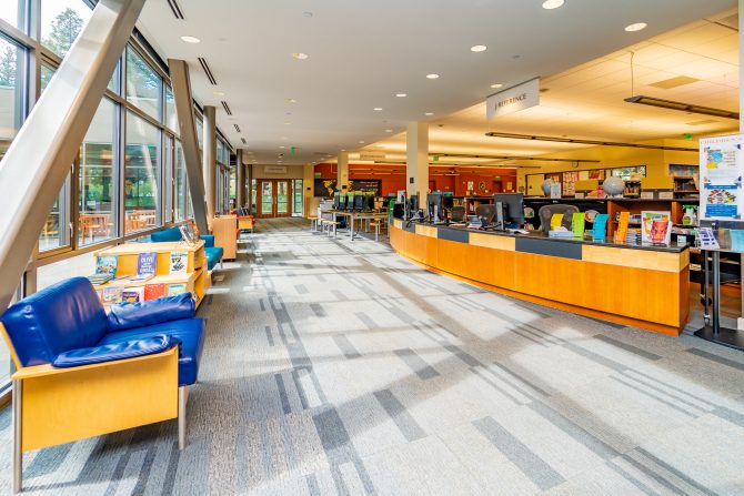 <p>Cupertino Library, downstairs, children's reference desk, information, tables</p>