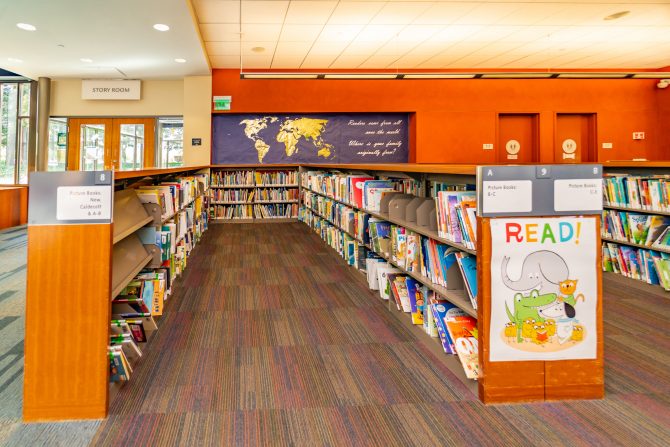 <p>Cupertino Library, downstairs, children's picture books, map, Story Room doors</p>