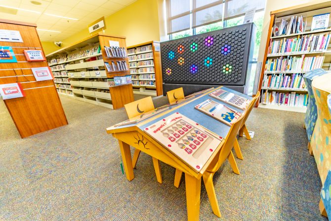 <p>Morgan Hill Library, children's play area, table, Everbright wall, light board, activity, magnetic puzzles</p>