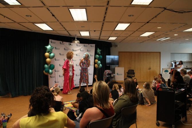 Image of two drag queens answering questions.