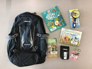 Image of the Ontario Park Pass Backpak with all of its contents laid out on a table.
