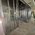 Metal framing of the new walls for the accessible washroom