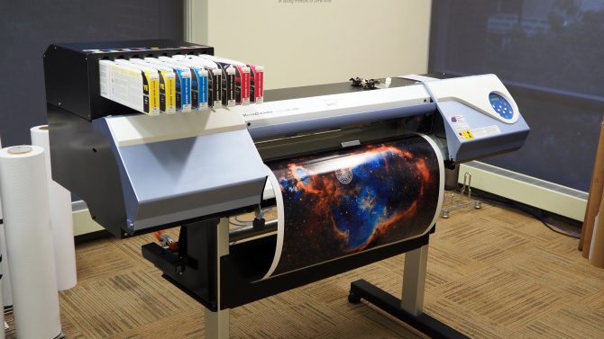 Photo of the vinyl printer/cutter in use