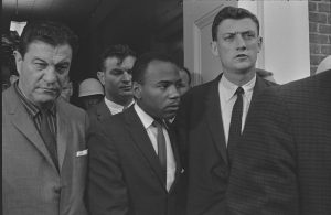 James Meredith is escorted to class by U.S. Marshals in 1962.