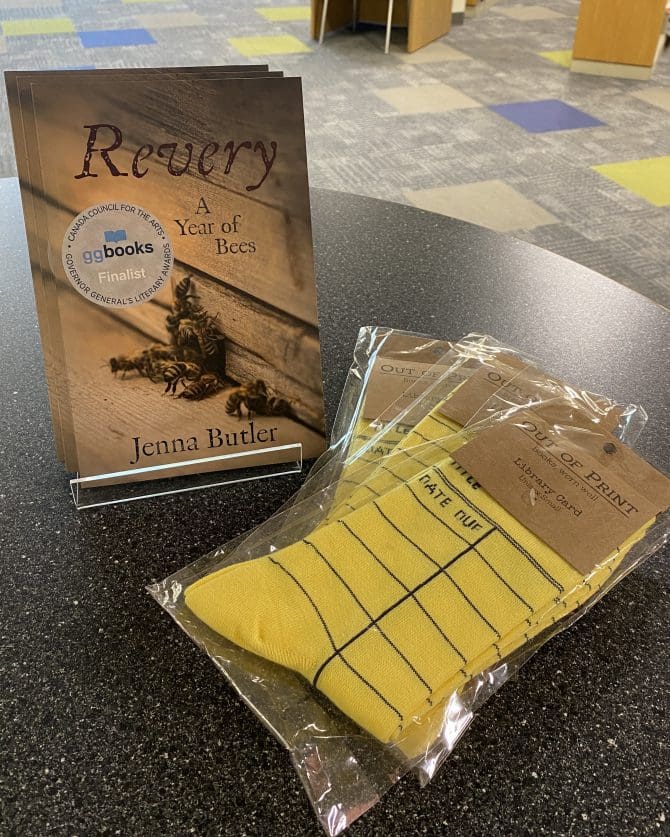 Revery: A Year of Bees book with library card socks