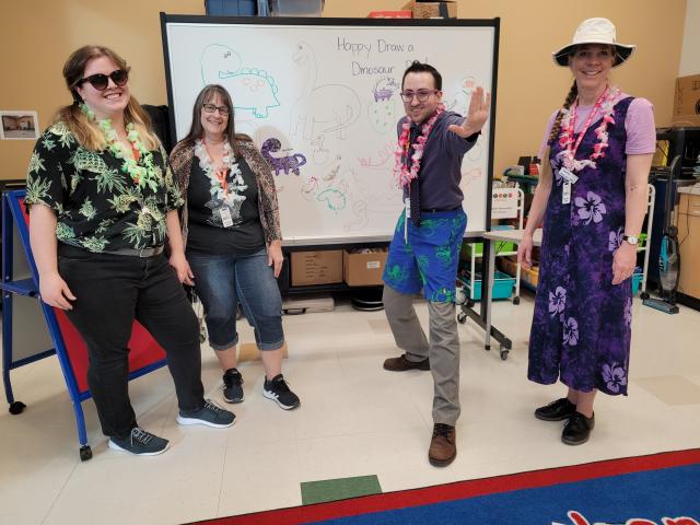 Library staff dressed in beachwear in the program room at the Timberlands Branch