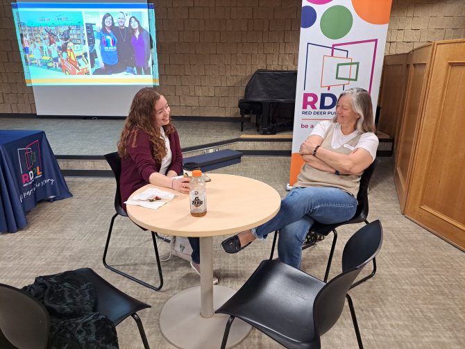 Two former RDPL staff chatting at the reunion